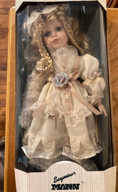 A Connoisseur Collections Porcelain Doll By Seymour Mann Limited Edition