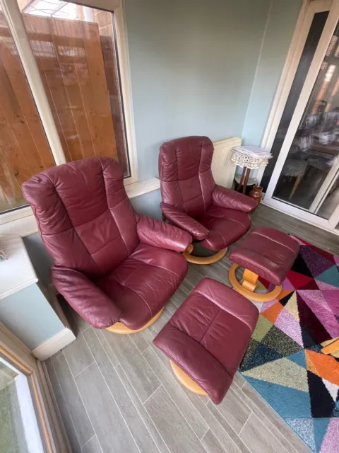 EKORNES STRESSLESS Chairs and Footstools Pair Of Red Leather Armchairs.