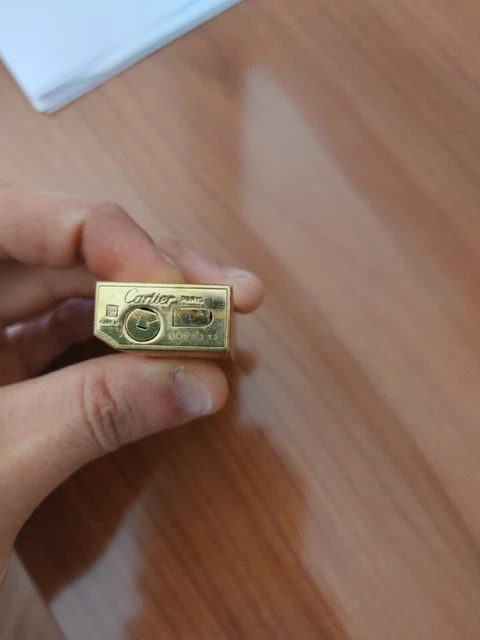 accendino Cartier placcato oro pentagon