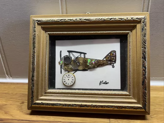 Aeroplane Picture Framed Made From Watch Parts.