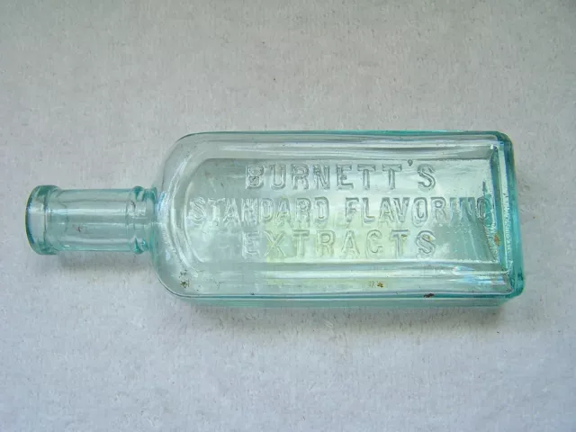 Antique Burnett's Standard Flavoring Extracts Cork Top Aqua Bottle 5 1/2" Tall