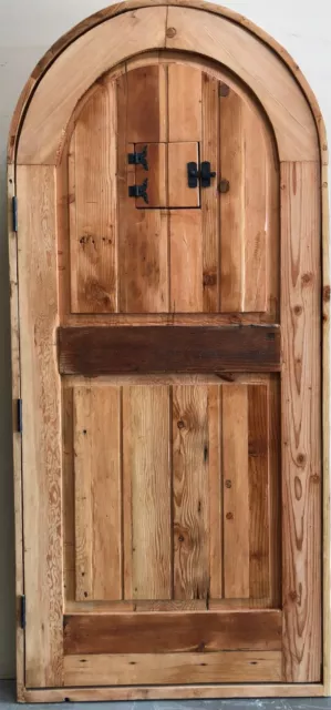 Rustic reclaimed lumber arched top storybook winery DOOR speakeasy wrought iron 2
