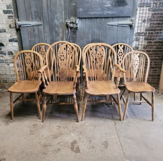 Eight Antique Wheel Back Elm And Beech Dining Chairs