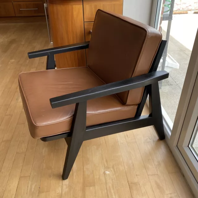 two midcentury style leather armchairs