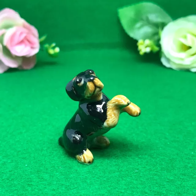 Tiny Rottweiler Kid Leg Raise Miniature Ceramic Animal Statue Collectible Decor
