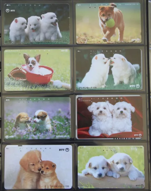 LOT DE 8 TELECARTE JAPON CHIENS DOGS CHIOTS  parfait état 07