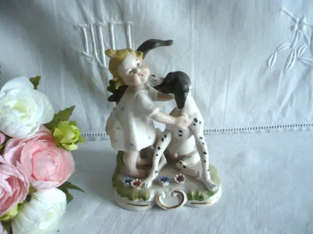 Ancienne figurine porcelaine biscuit enfant chien Andrea by Sadek peint main