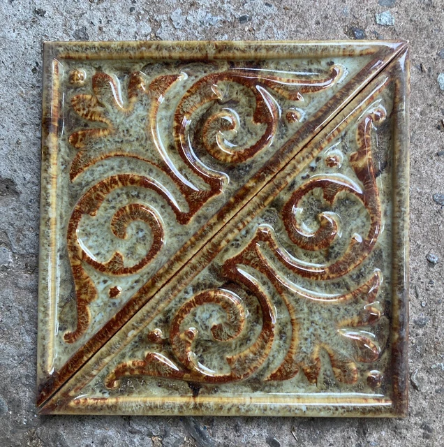 Two decorative glazed antique Triangular tiles by Maws of Jackfield, Ironbridge