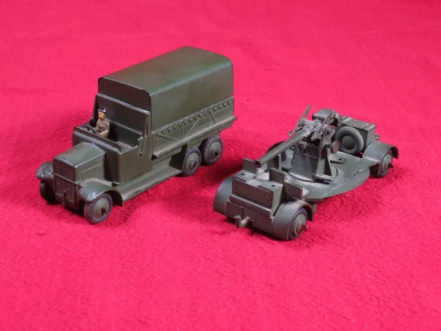 Vintage Dinky Toys covered truck and anti-aircraft gun on trailer military