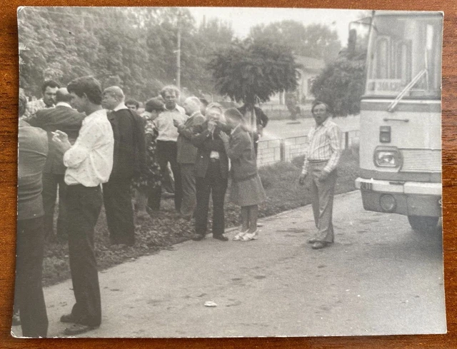 Beautiful guys and girls near the bus. Vintage photo