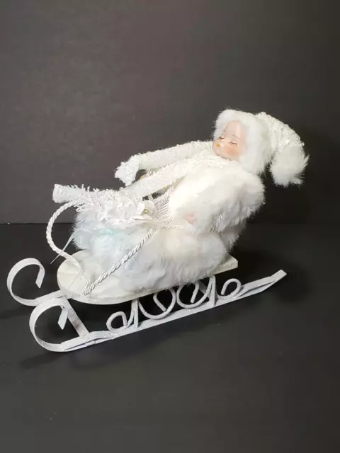 Heritage House Winter Baby Porcelain Doll  In White Sleigh Signature Collection