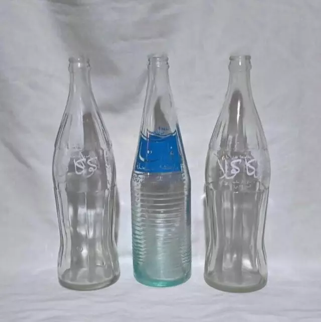 Collection of vintage Coca-Cola and Fanta bottles of 77 CL arabic writting old