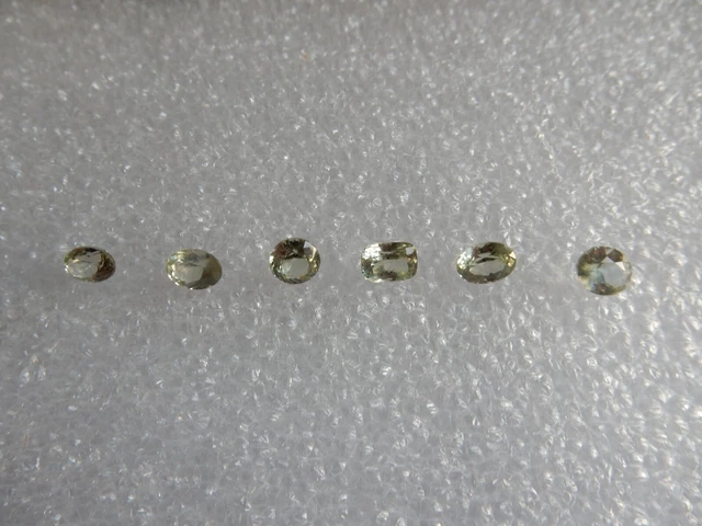 Diopside x 6, shades of pale green, 7.26cts total