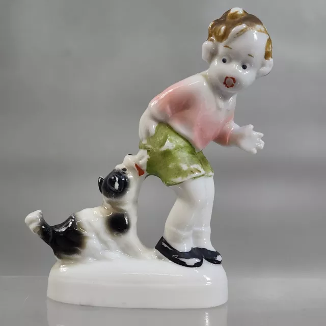 Antique German Fairing Figurine Porcelain Dog Biting Boy Girl Early 1900s