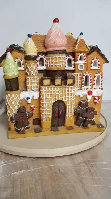 Gingerbread House With Gingerbread Family in front w/ligth and 6 power oulets