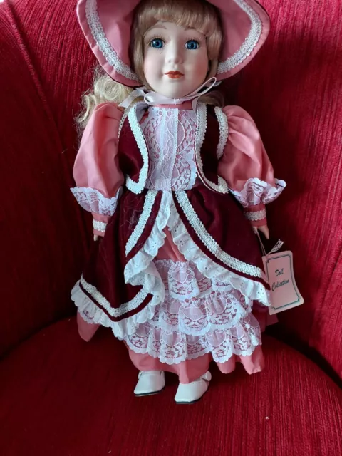 Porcelain doll dressed immaculate clothing. Circa 1980