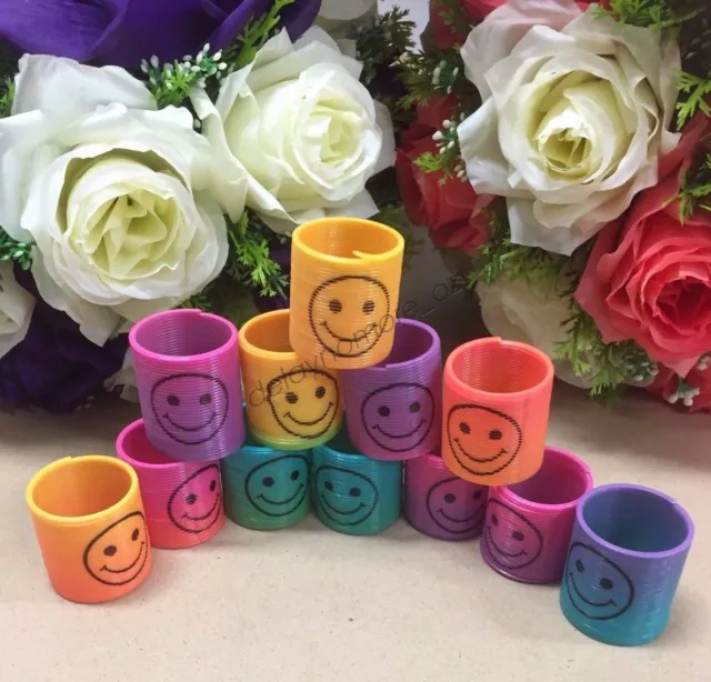 12 x Mini Spring Rainbow Slinky Plastic Kids Party Favour Smiley Treat Loot Bag