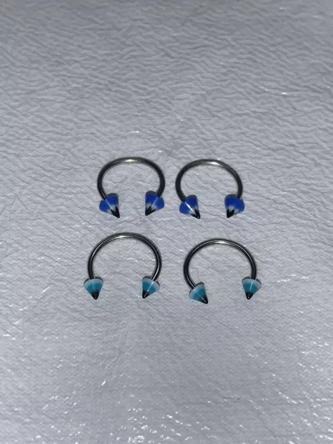 Blue Cone Tip Curved Barbell Piercings. New!