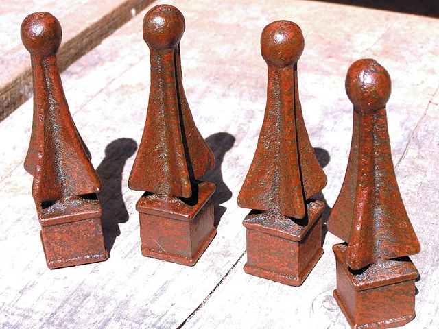 FOUR cast iron finials Rusted and sealed finish