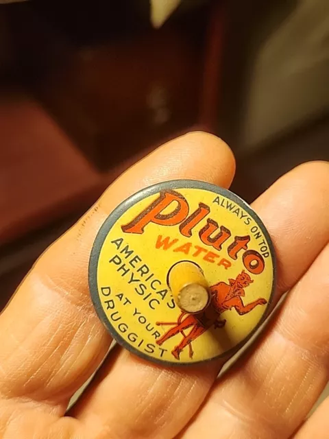 Antique PLUTO WATER Advertising Toy Spinning Top Round Celluloid Druggist Cure