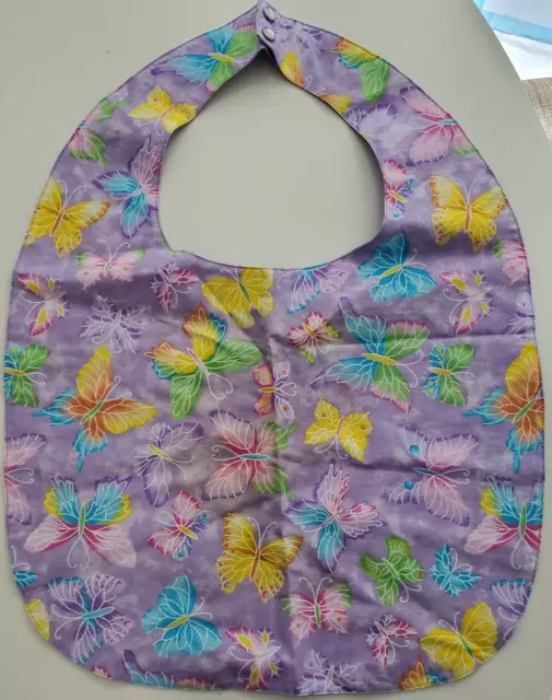 Protector de ropa para adultos - babero con mariposas. Hermosos colores pastel