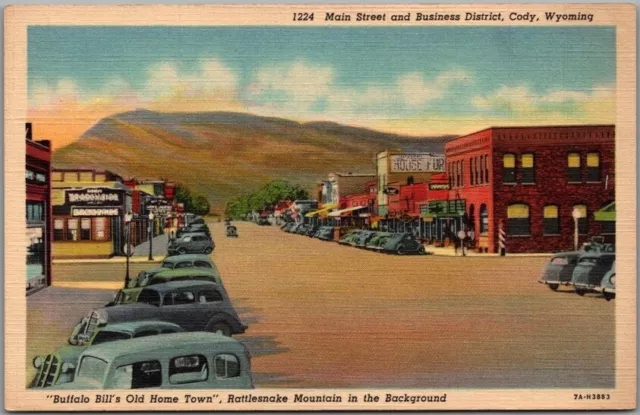 Vintage 1937 CODY, Wyoming Postcard Main Street Downtown Scene / Curteich Linen