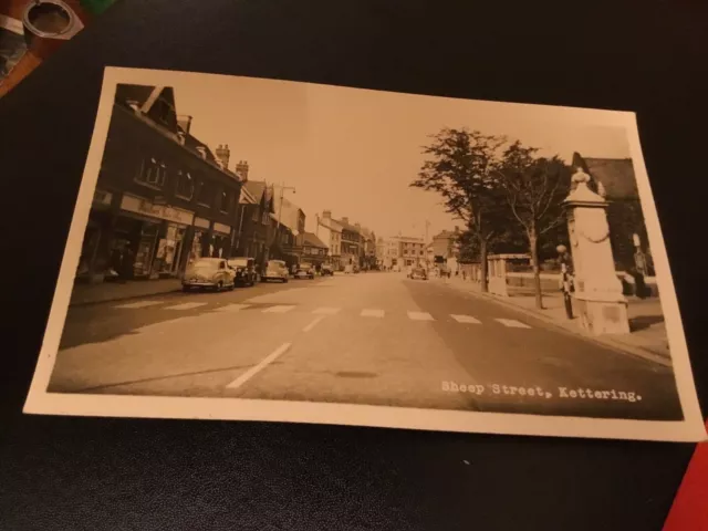 RP 1950s Postcard Kettering  Northamptonshire Sheep Street Shopping Parade