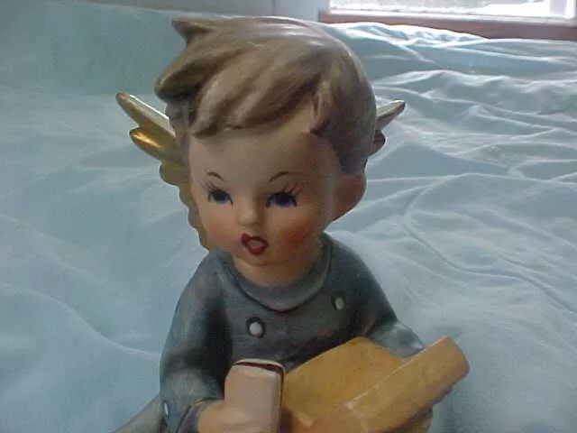 Vintage/Antique Angel Figurine With Box Sitting On Grass