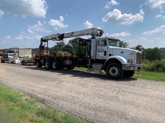 2003 6x6 Peterbilt equipped with a Fassi F390 and 92 ft reach 16” grapplesaw
