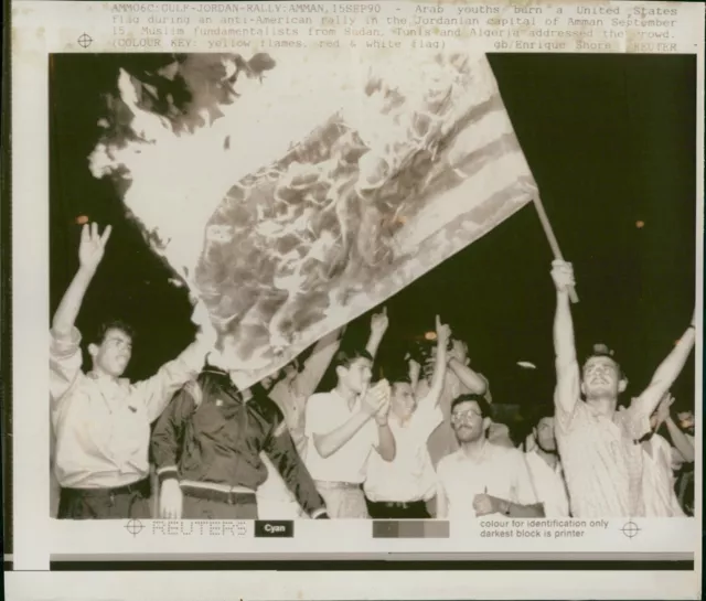Arab youths burn a United States flag during an... - Vintage Photograph 1913409