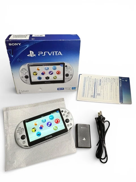 PS VITA SLIM AVEC 18 JEUX MEMOIRE 32 GIGA + SACOCHE ET SAC + CABLE