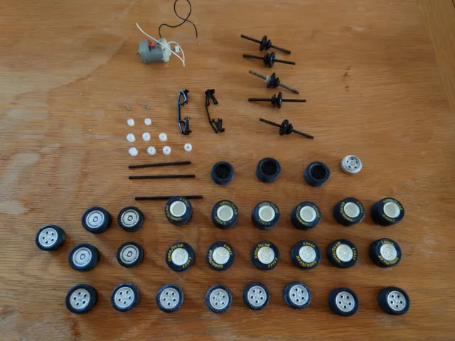 Scalextric spare items - axles, wheels, motors, axle items - collection