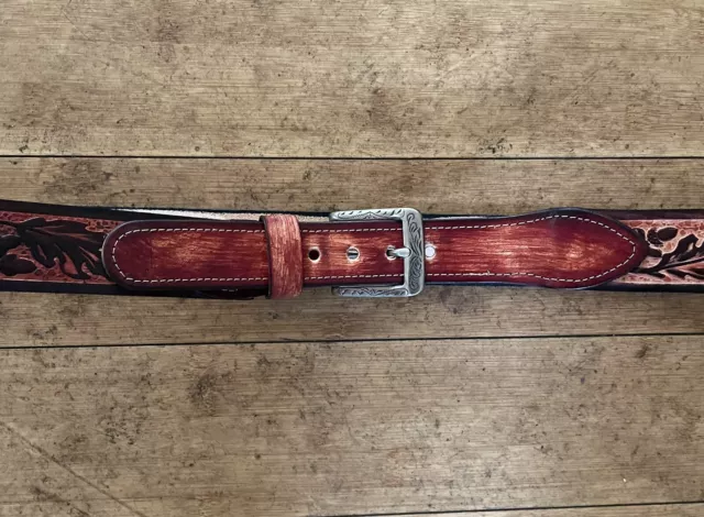 Western  ￼ Embossed Jean  belt  with leather tab closure made in USA