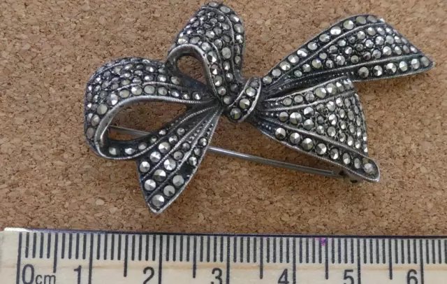 Vintage Silver & marcasite bow brooch 12.1g one marcasite missing stamped SILVER