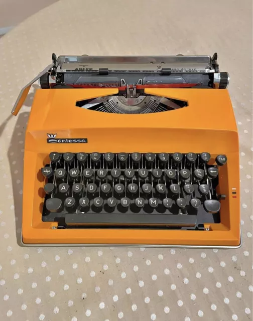 Vintage orange Contessa Adler 1970’s Typewriter in Original Case Made in Holland