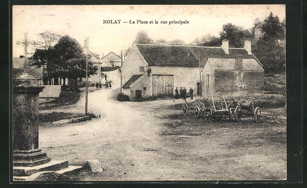 CPA Nolay, la Place et la rue principale 1931