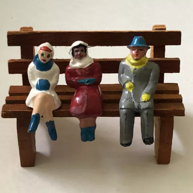 Lot of 3 Vintage Cast Lead Adult Sitting on wood bench Red White Gray