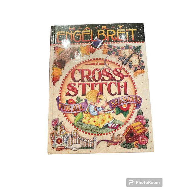 Libro de punto de cruz de Mary Engelbreit para todas las estaciones diseños alegres coloridos