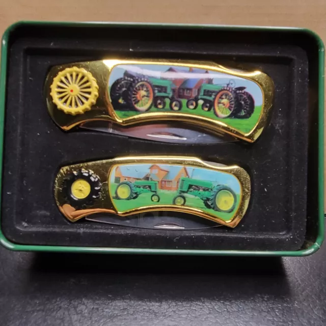 John deere pair of tractor collectors folding knives in tractor tin gold tone