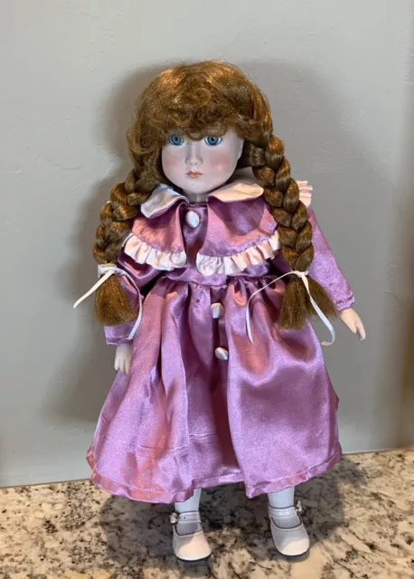 Vintage porcelain doll red hair blue eyes With pink satin dress 16”