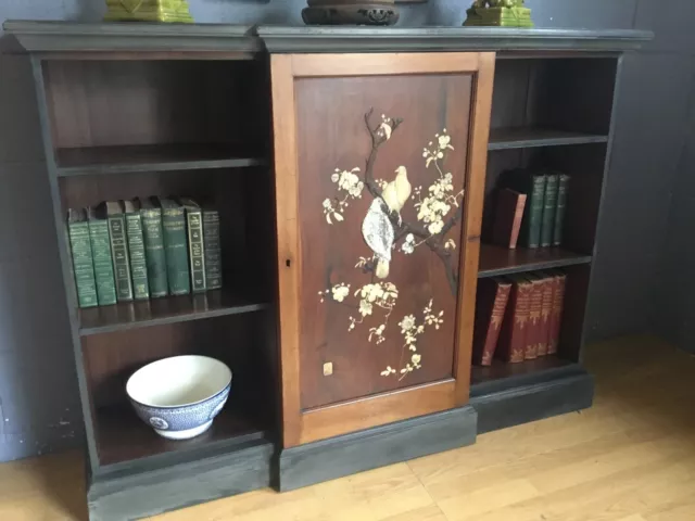 A floor standing open  book case/cabinet with Chinese panel late Victorian