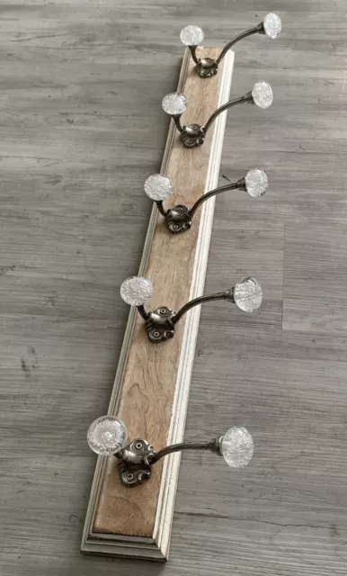 Metal Coat Hooks Mounted On Barn board .Clear Glass Knobs Filled With Bubbles