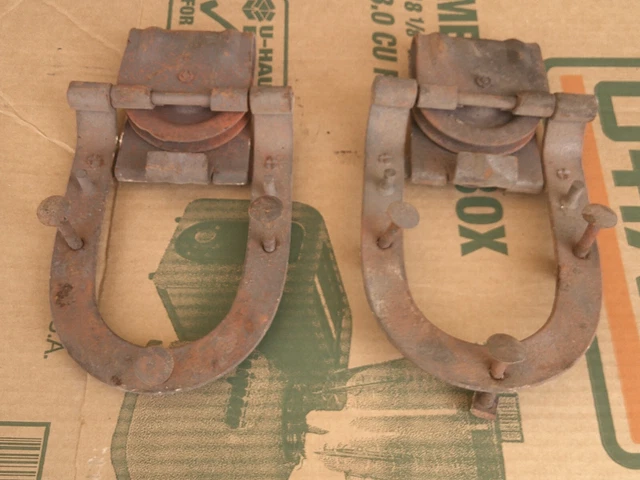pair curved shaped barn door rolllers, no markings. froze up, 1 wheel chipped.