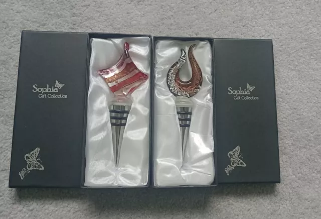 Sophia gift collection decorative glass wine bottle stoppers.  Both new in box