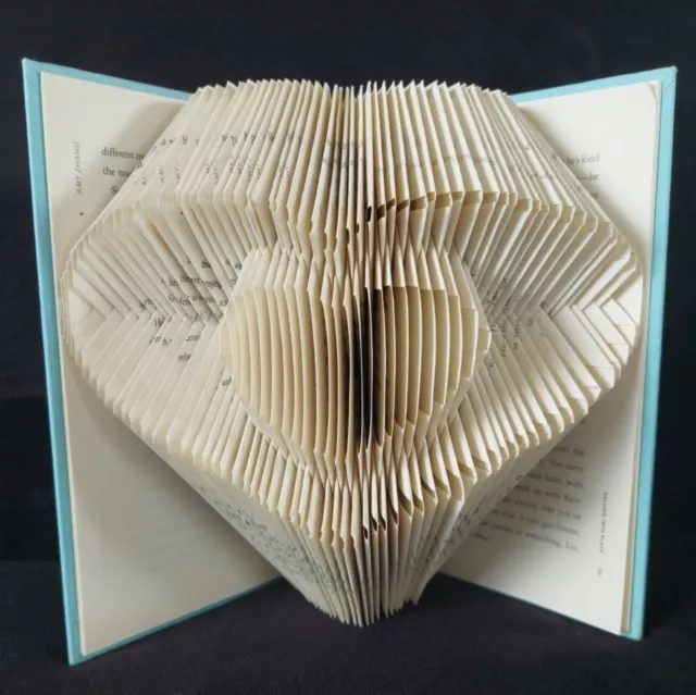 Folded Book Art With the Word “Love”