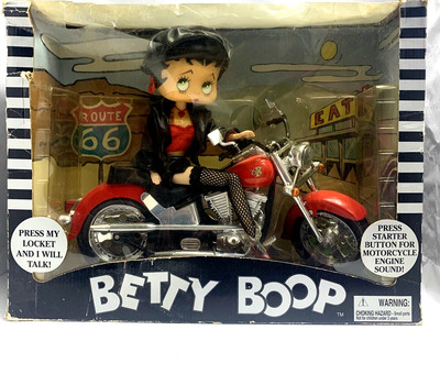 Vintage 1999 talking betty boop doll on a motorcycle about 12 in long and high