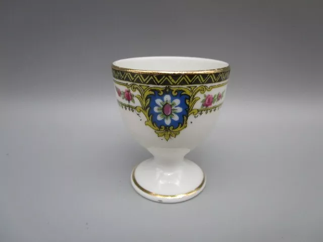 Coquetier ancien en porcelaine de Limoges