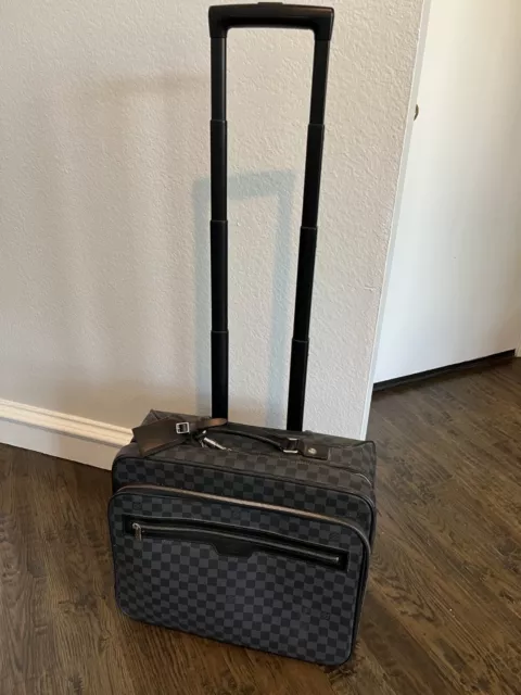 Louis VUITTON Checkroom suitcase in monogrammed coated …