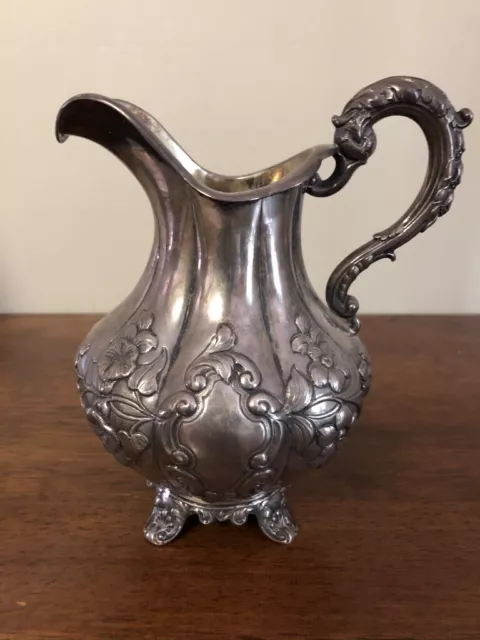 Antique sterling pitcher. Old English piece with serpent/dragon  handle