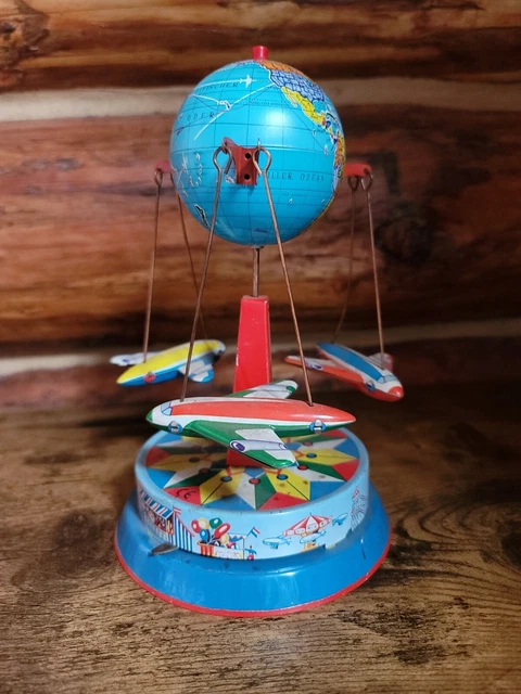 Flying Globe Rides FLIGHT AROUND THE World Lever Wind Tin Toy Airplane Globe Fair Ride ...